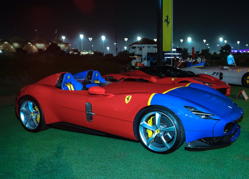 A Ferrari Monza SP2 in red and blue, with yellow highlights