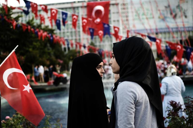 Young women in headscarves attend a pro-Turkish government rally outside city hall in Istanbul in 2017. AFP
