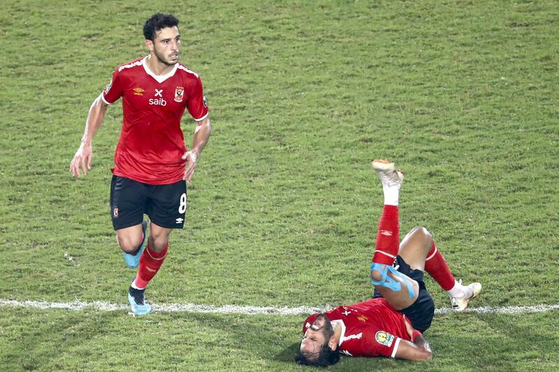 Ahly's forward 	Marwan Mohsen (R) reacts following a challenge during the CAF Champions League Final football match between Egyptian sides Zamalek and Al-Ahly at the Cairo International Stadium in Egypt's capital on November 27, 2020. (Photo by Khaled DESOUKI / AFP)