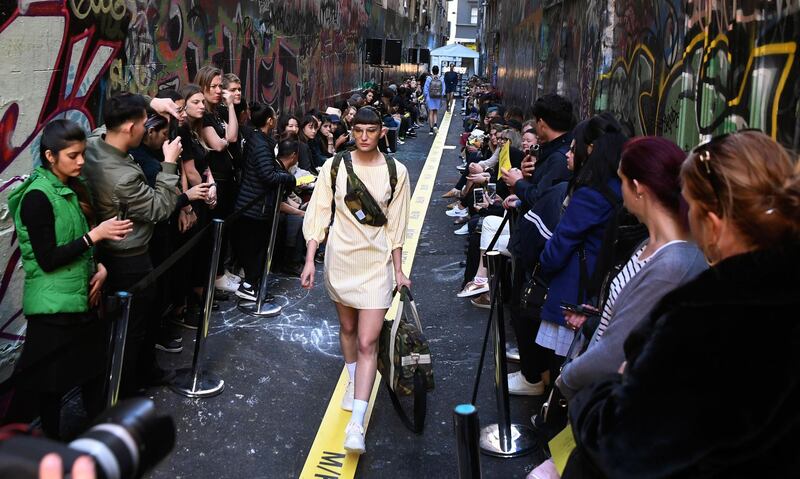 A model parades an outfit by Australian label Beekeeper Parade during a Melbourne Fashion Week show in an inner-city laneway. William West/AFP