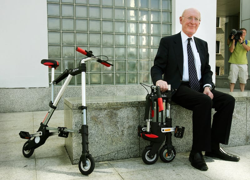 Sir Clive Sinclair poses for a photograph during the launch of his A-bike in 2006. AFP