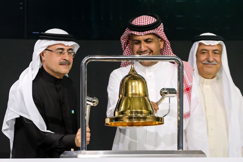 President and CEO of Saudi Aramco Amin Nasser (L) rings the bell.  EPA