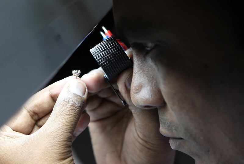 A worker prepares a gold jewellery at Damas' new facility at Nad Al Hamar area in Dubai. Pawan Singh / The National