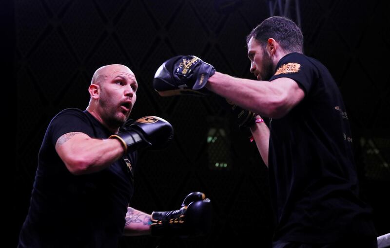 British heavyweight Tom Little is put through his paces by a trainer. Reuters