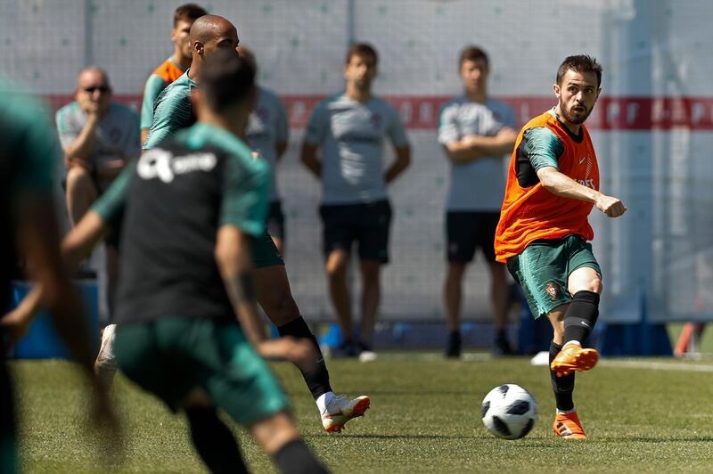 Portugal's Bernardo Silva, right, plays the ball with teammates during the training session of Portugal at the 2018 soccer World Cup in Kratovo, outskirts Moscow on Friday. Francisco Seco /  AP Photo