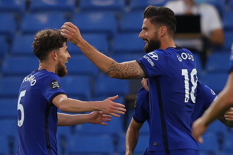 Giroud (R) celebrates with teammates after his goal. AFP