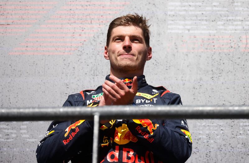 Red Bull's Max Verstappen celebrates on the podium after winning the Belgian Grand Prix on Sunday, July 30, 2023. Reuters