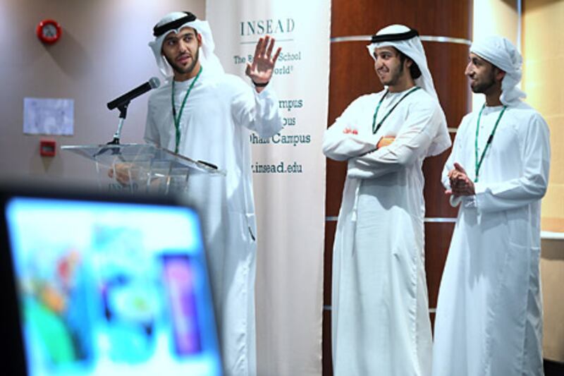 ABU DHABI, UNITED ARAB EMIRATES -  March 18, 2012 -  Emirati students, Ahmed al Marzouqi (from left), Homad Al Neyadi and Mohammed al Shamsi make a business presentation during an Insead business event.   ( DELORES JOHNSON / The National )