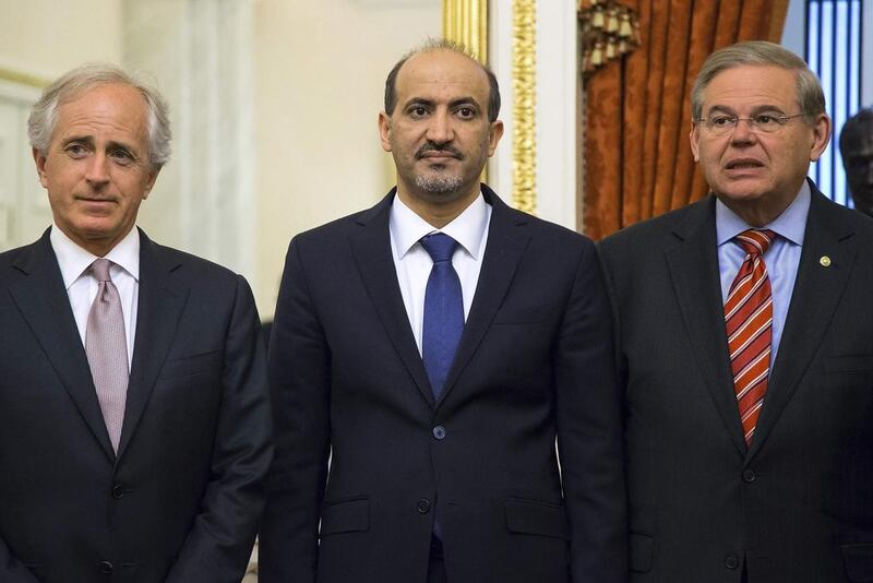Senators Bob Corker, left, and Robert Menendez, right, of the Senate Foreign Relations Committee with the Syrian National Coalition president Ahmad Jarba in Washington on May 7, 2014. Jonathan Ernst / Reuters