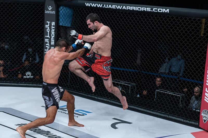 Muin Gafurov of Tajikistan lands a flying knee on Walter Zamora of Costa Rica in the featherweight in the UAE Warriors 15 at the Jiu-Jitsu Arena on Friday, January 15, 2021. Courtesy UAE Warriors