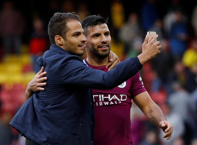 Soccer Football - Premier League - Watford vs Manchester City - Vicarage Road, Watford, Britain - September 16, 2017   A fan invades the pitch and takes a photo with Manchester City's Sergio Aguero        REUTERS/Darren Staples    EDITORIAL USE ONLY. No use with unauthorized audio, video, data, fixture lists, club/league logos or "live" services. Online in-match use limited to 75 images, no video emulation. No use in betting, games or single club/league/player publications. Please contact your account representative for further details.