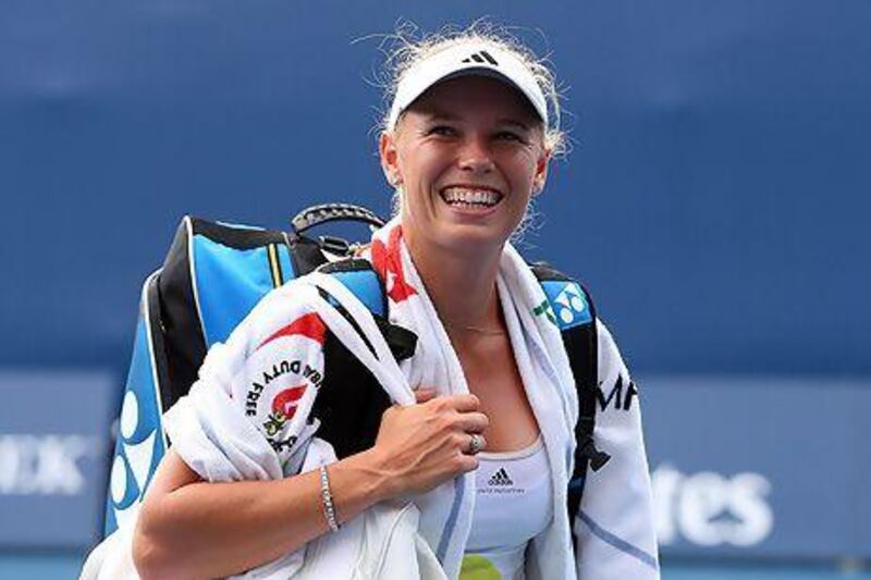 Caroline Wozniacki smiles after her second straight sets win in as many days. Julian Finney / Getty Images