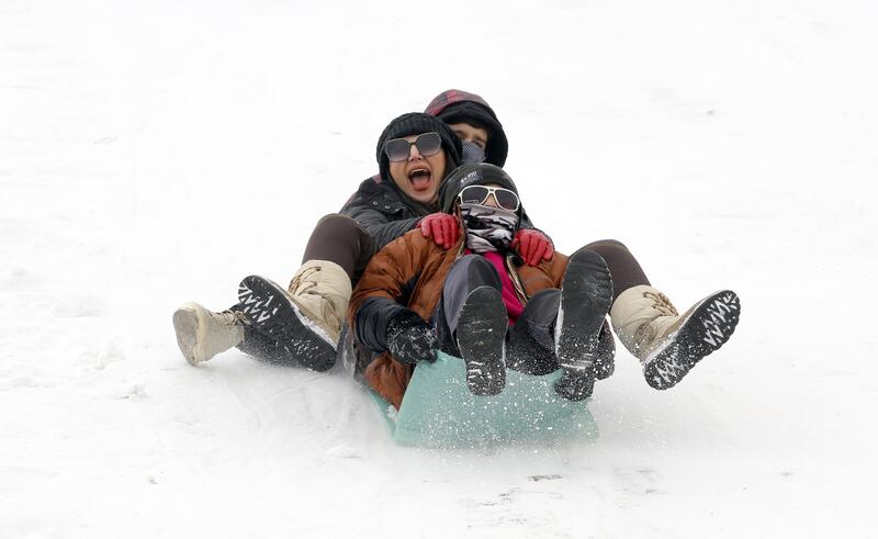 Iranians enjoy the snow at the Abali ski resort in city of Abali, northeast of the capital city of Tehran, Iran, 26 January 2023.   EPA / ABEDIN TAHERKENAREH