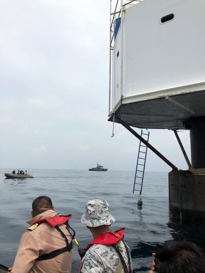 epa07505314 A handout photo made available by the Royal Thai Navy (RTN) shows Thai naval officers from the Third Naval Area Command and staff judge advocates inspecting a 'Seastead', a floating 'living platform' in the Andaman Sea, some 12 nautical miles off the coast of Phuket island, southern Thailand, 13 April 2019 (issued 14 April 2019). According to media reports, Bitcoin entrepreneurs US national Chad Andrew Elwartowski and his Thai wife Supranee Thepdet, also known by her alias Nadia Summergirl, allegedly built the platform in international waters with the intent to set up a permanent outpost out of any state territories. The structure was said to fall under the jurisdiction of no government but still inside Thailand's exclusive economic zone, media added. Thai authorities consider the platform illegal and it could be ordered to be removed, whereas for the couple they could face criminal charges for allegedly causing the country or parts of it to fall under the sovereignty of a foreign state or deterioration of the state's independence, media quoted local sources as saying.  EPA/ROYAL THAI NAVY HANDOUT  HANDOUT EDITORIAL USE ONLY/NO SALES