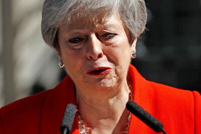 TOPSHOT - Britain's Prime Minister Theresa May reacts as she announces her resignation outside 10 Downing street in central London on May 24, 2019. Beleaguered British Prime Minister Theresa May announced on Friday that she will resign on June 7, 2019 following a Conservative Party mutiny over her remaining in power. / AFP / Tolga AKMEN
