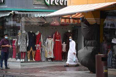 A man wears a surgical mask in Dubai. AFP