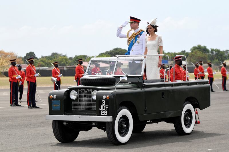 Britain's Prince William and his wife Kate in a vintage Land Rover used by Queen Elizabeth during her visit to Kingston, Jamaica, on the sixth day of their tour of the Caribbean. Reuters