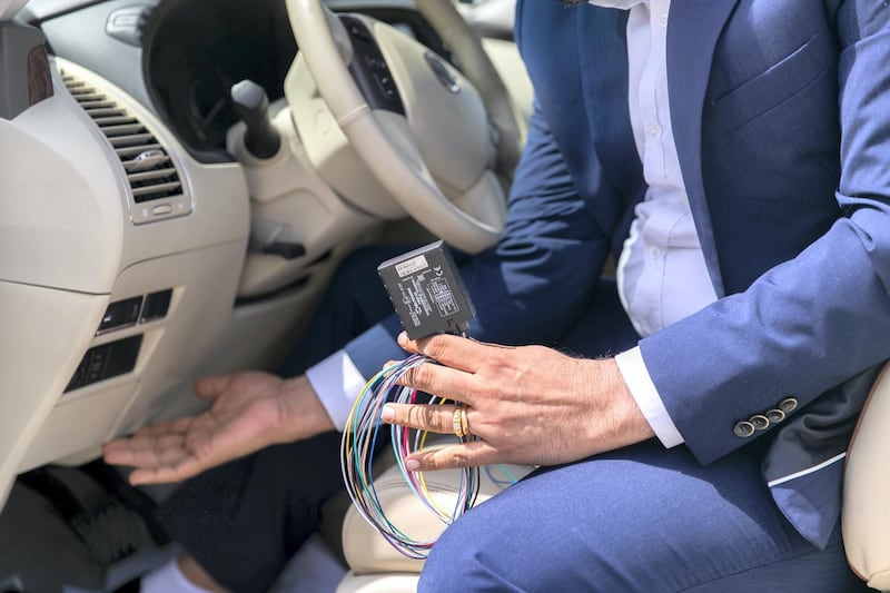 DUBAI, UNITED ARAB EMIRATES - OCTOBER 11, 2018. 

Dinesh Correa, Founder of Falcon Trackers for GPS tracking and safety solution, hold a vehicle tracking device, and points to where it's installed in a vehicle.

(Photo by Reem Mohammed/The National)

Reporter: RUBA HAZA
Section:  NA