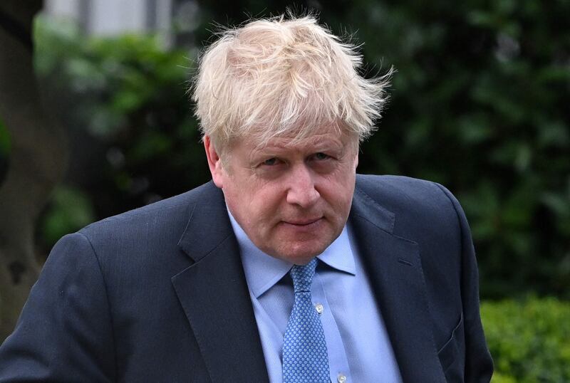 Former British Prime Minister Boris Johnson leaves his house in London on Wednesday morning. AFP