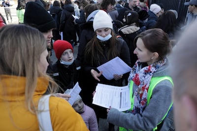 Refugees from Ukraine queue in Warsaw, Poland. EPA