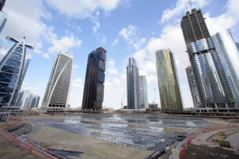 Dubai, 3rd March 2010.  The Jumeirah Lake Towers buildings with the man made lake under construction. Jumeirah Business Centre 5 is the third tower from the left (black).  (Jeffrey E Biteng / The National) 