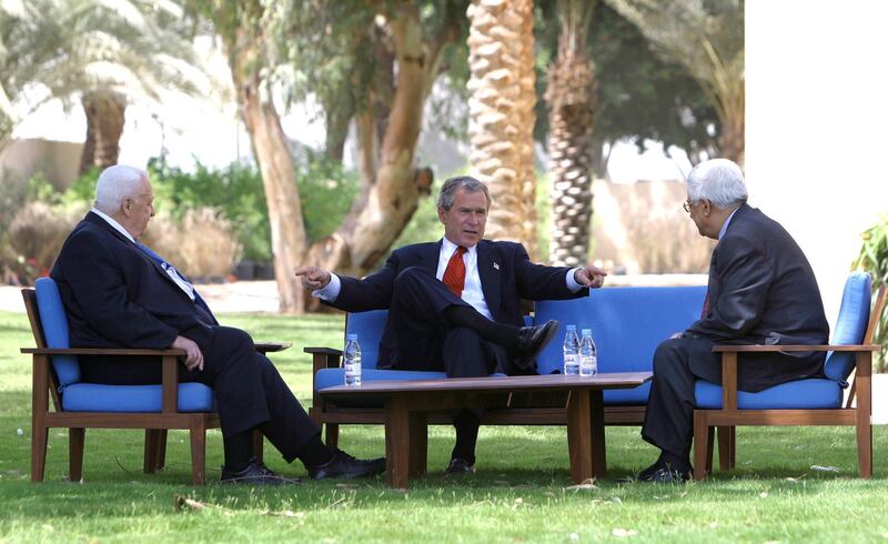U.S. President George W. Bush discusses the Middle East peace process
with Prime Minister Ariel Sharon of Israel (L) and Palestinian Prime
Minister Mahmoud Abbas (R) in Aqaba, Jordan, June 4, 2003. REUTERS/Paul
Morse/White House

HK/ME