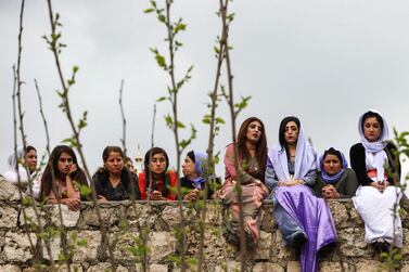 Iraqi Yazidi women sit outside the Temple of Lalish, in a valley near the Kurdish city of Dohuk about 430 kilometres northwest of the capital Baghdad, on April 16, 2019. AFP