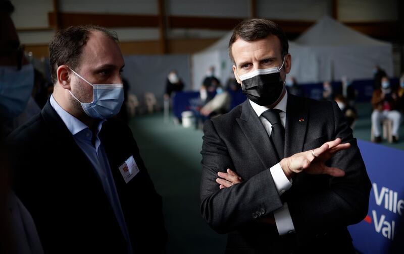 epa09091084 French president Emmanuel Macron during a visit to the valenciennes vaccination center, Valenciennes, France, 23 March 2021. Macron is paying a visit to the center on 23 March accompanied by the Minister of Health Olivier Véran in a move to promote vaccination amongst citizens.  EPA/Yoan Valat / POOL