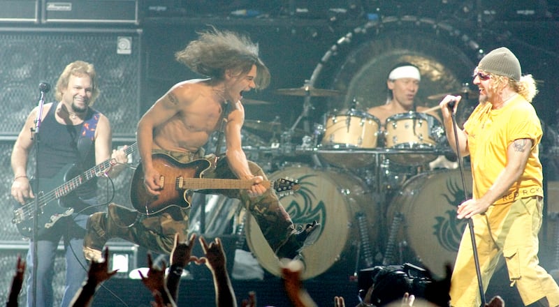Members of the rock group Van Halen (L-R) bassist Michael Anthony, guitarist Eddie Van Halen, drummer Alex Van Halen and singer Sammy Hagar, performs during the first of two-sold-out shows at the Mandalay Bay Events Center in Las Vegas, Nevada late August 6, 2004. The band is touring in support of the new two-disc compilation "The Best of Both Worlds." Picture taken August 6. REUTERS/Ethan Miller  EM