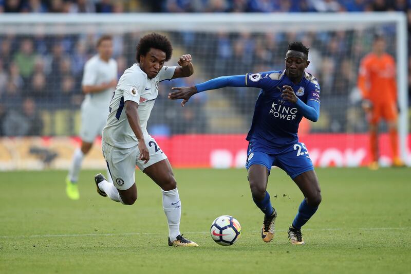 Chelsea midfielder Willian and Leicester midfielder Wilfried Ndidi challenge for the ball. Clive Mason / Getty Images