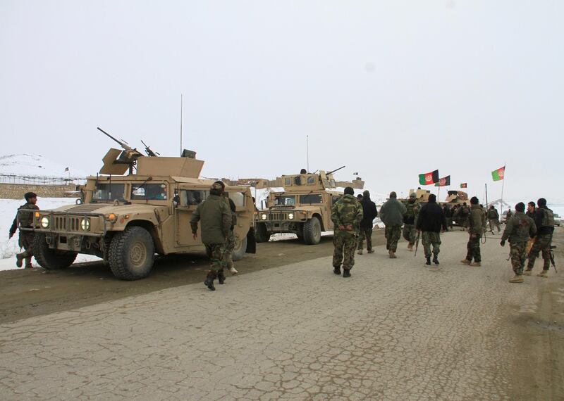 Afghan National Army forces go towards the site of an airplane crash in Deh Yak district of Ghazni province, Afghanistan January 27, 2020. REUTERS/Mustafa Andaleb