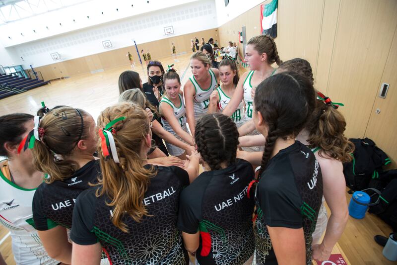 UAE Falcons Eyasses players in a huddle.