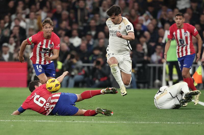 Atletico Madrid's Koke challenges Brahim Diaz of Real. AFP