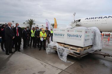Officials inspect boxes of Sputnik V vaccines at Tunis-Carthage airport on Tuesday. EPA / Mohamed Messara