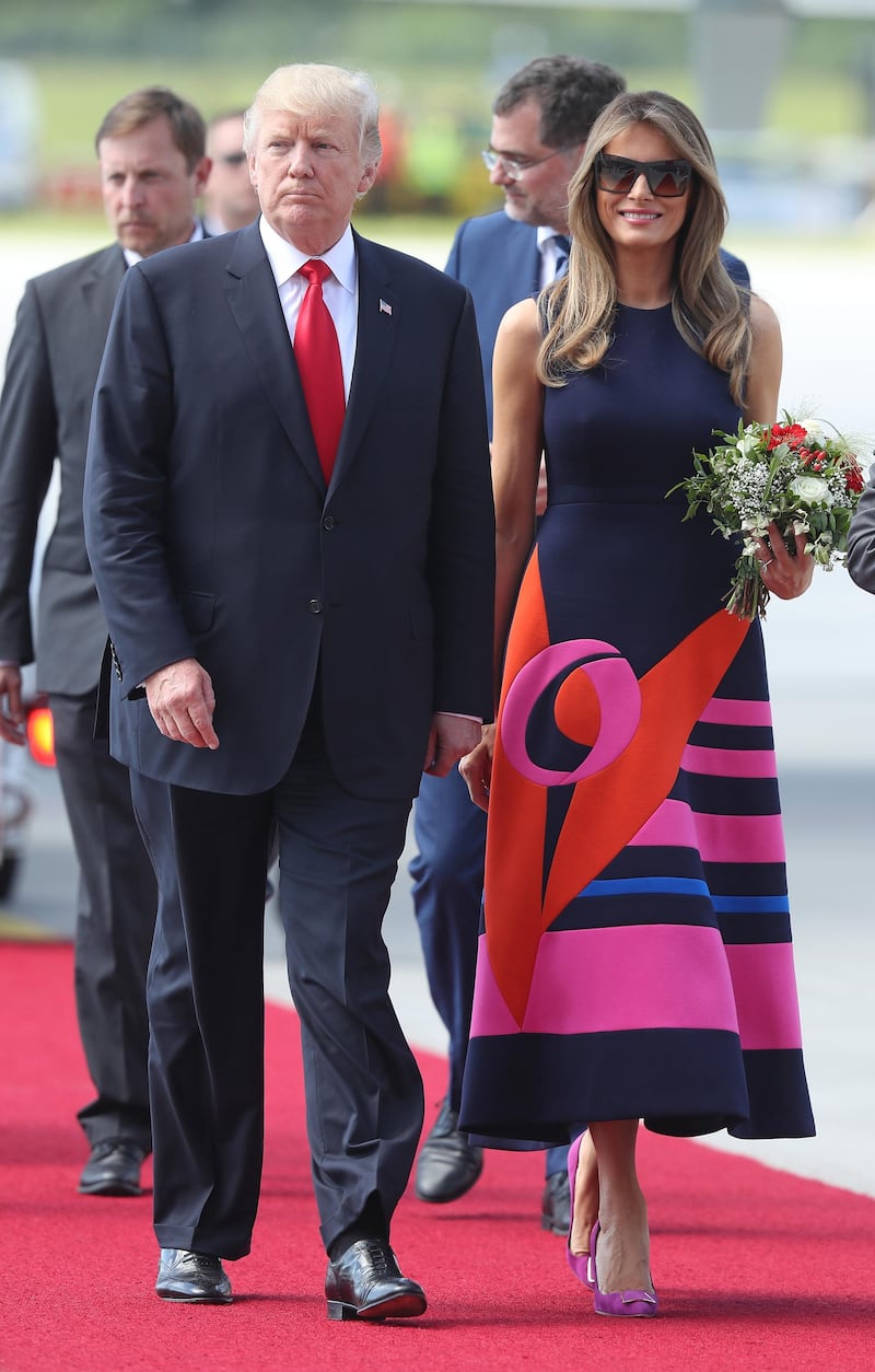 HAMBURG, GERMANY - JULY 06:  U.S. President Donald Trump and First Lady Melania Trump arrive at Hamburg Airport for the Hamburg G20 economic summit on July 6, 2017 in Hamburg, Germany. Leaders of the G20 group of nations are meeting for the July 7-8 summit. Topics high on the agenda for the summit include climate policy and development programs for African economies.  (Photo by Sean Gallup/Getty Images)