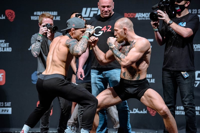 Dustin Poirier vs. Conor McGregor 2 weigh-in staredown.  Getty Images