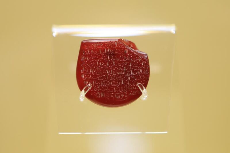 Agate inscribed with the Ayat Al-Kursi in reverse, 17th-18th Century AD, from Iran on display.