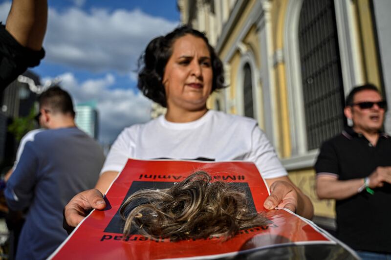 Members of feminist groups and Iranian migrants during the protests in Santiago. AFP