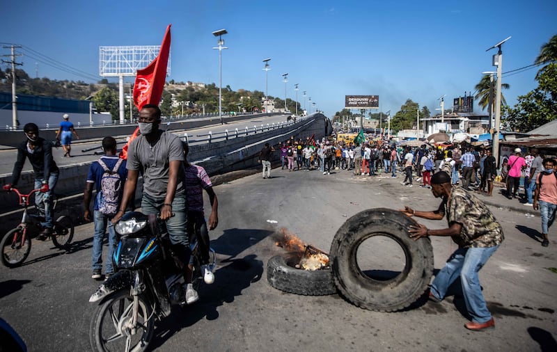 Factory workers on strike for better pay in Port-au-Prince, Haiti. The textile workers are demanding a three-fold increase in their wages of $5 a day. AFP