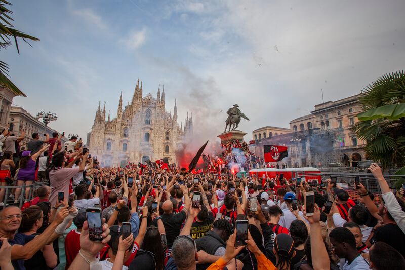 AC Milan fans celebrate in Piazza Duomo square after the club won the Serie A title. AP