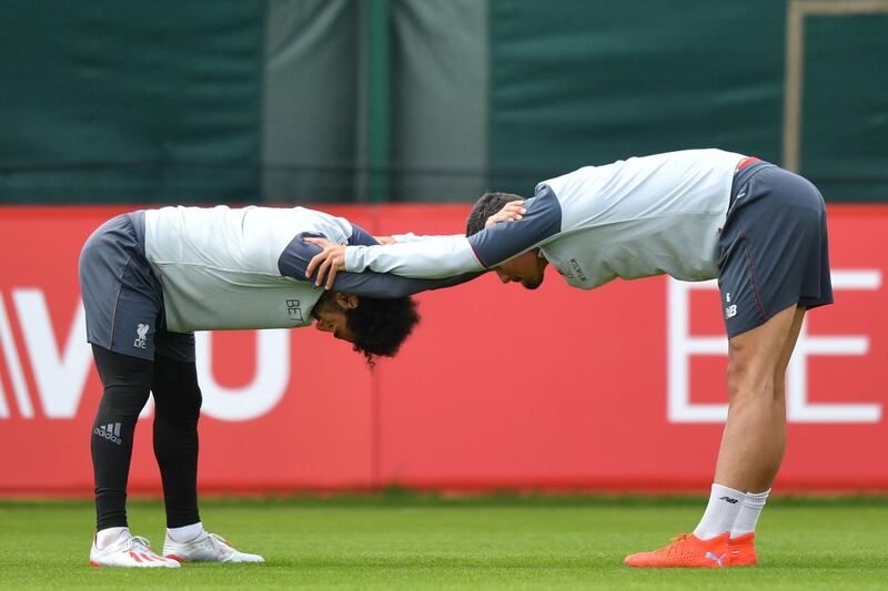 Liverpool's Mohamed Salah and Dejan Lovren. AFP