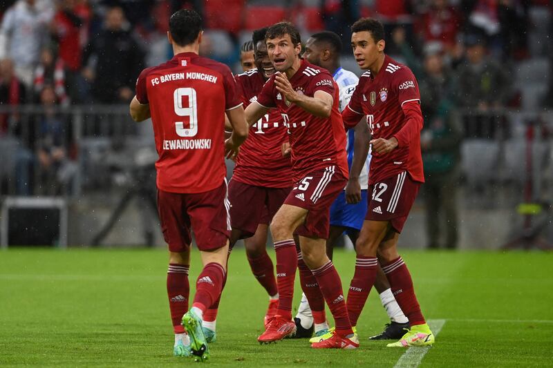 Bayern  forward Thomas Muller (C) celebrates scoring the opening goal. AFP