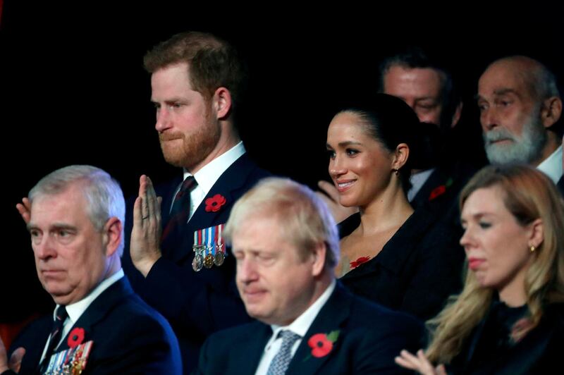 Prince Andrew, Duke of York, sat beside Prime Minister Boris Johnson and Carrie Symonds, with Prince Harry and Meghan, Duchess of Sussex, sat behind. AFP