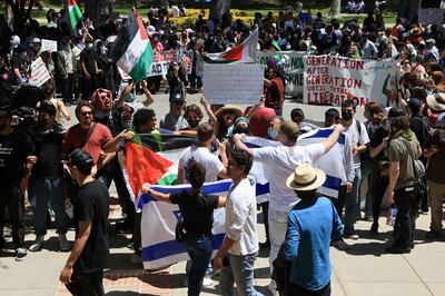 Pro-Israel counter-protesters display Israeli flags near a pro-Palestine demonstration at the University of California Los Angeles last week. Reuters