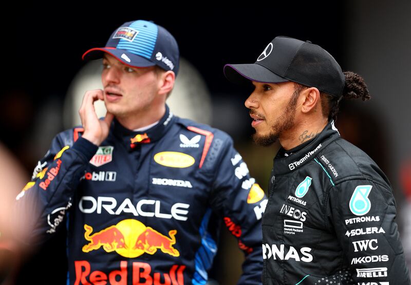 Mercedes' Lewis Hamilton with Red Bull's Max Verstappen. Reuters