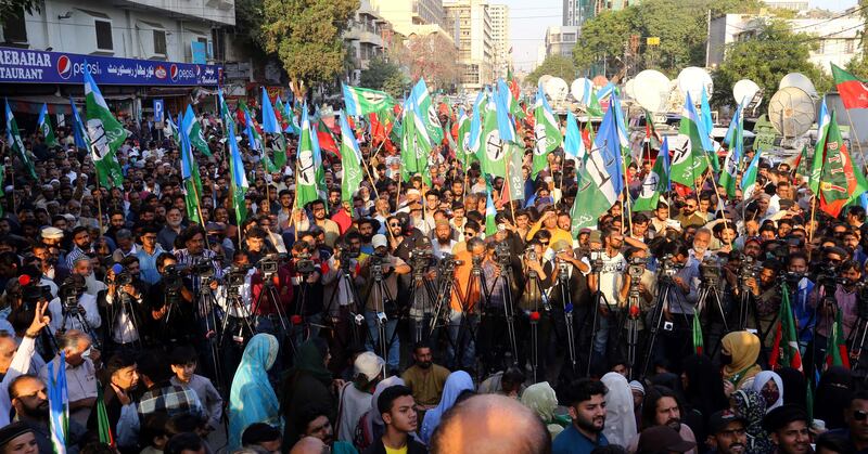 PTI and TLP supporters in Karachi. EPA