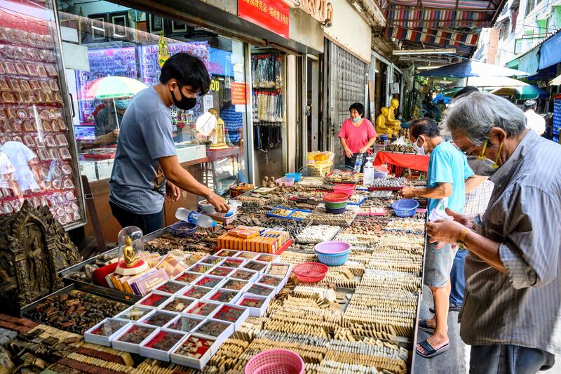 Market shopping in Bangkok. Photo by Mladen Antonov /  AFP