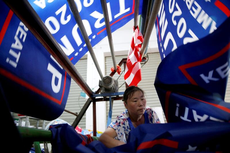 A worker makes flags for U.S. President Donald Trump's "Keep America Great!" 2020 re-election campaign at Jiahao flag factory in Fuyang, Anhui province, China July 24, 2018. Picture taken July 24, 2018. REUTERS/Aly Song