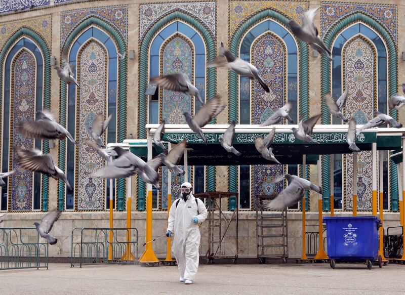 A worker in a protective suit sprays disinfectants near Imam Abbas shrine in the holy city of Kerbala, Iraq. Reuters