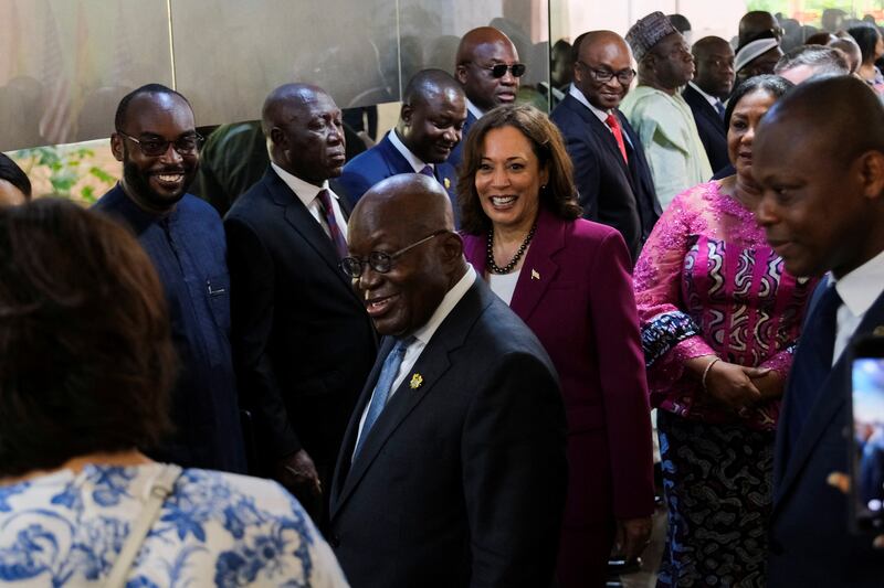 Mr Akufo-Addo introduces Ms Harris to some of the country's ministers upon her arrival. Reuters